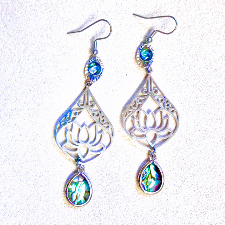 Silver earrings with intricate lotus designs and colorful abalone shell 