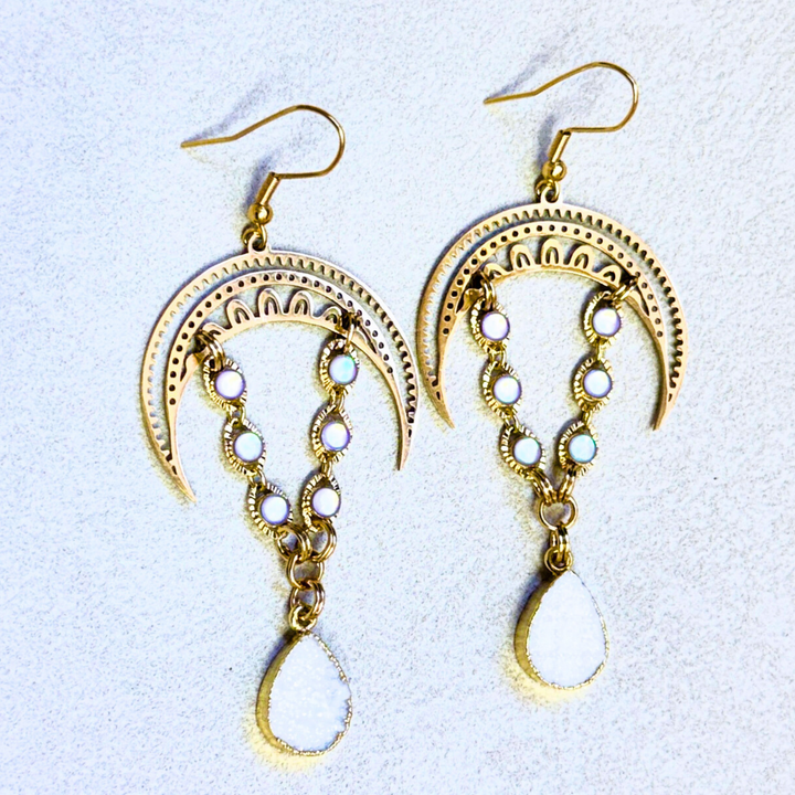 Gold earrings with moon and teardrop druzy designs 