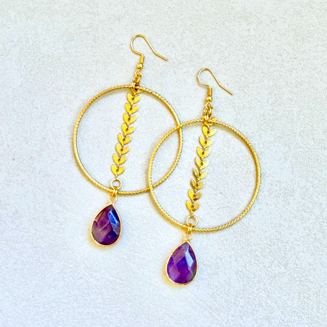 Gold hoop earrings with purple teardrop amethyst stones and delicate leaf chain